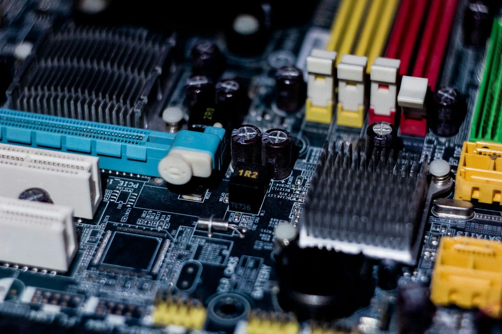 A motherboard with yellow, red and blue cable connectors